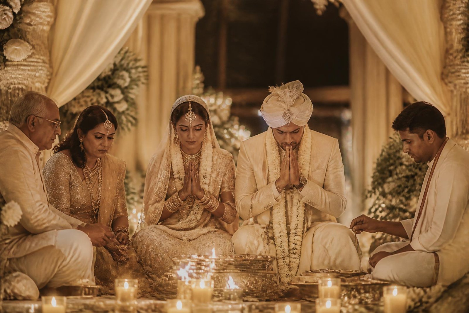 Candlelit wedding ceremony under a floral mandap