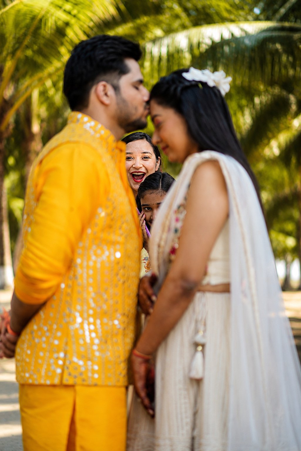 Bride and groom resting their foreheads together during a destination wedding ceremony